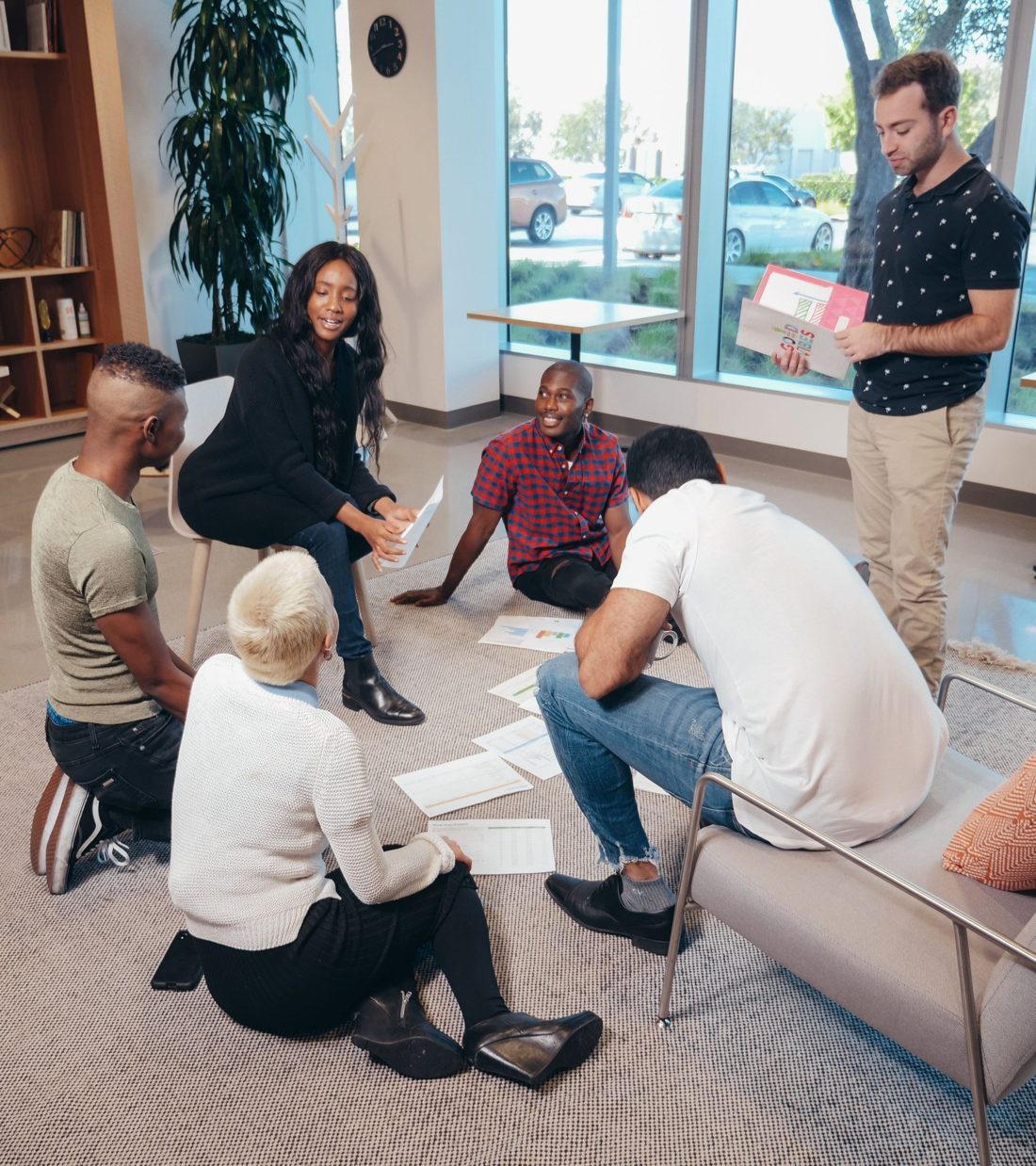 A team talking through lessons learned together in a circle